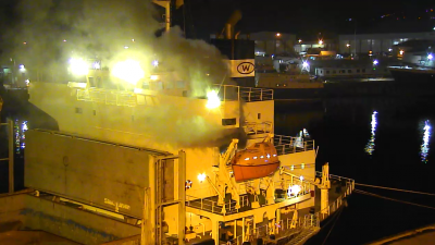 Taokas Wisdom - smoke billowing from the port-side emergency exit door on the B-