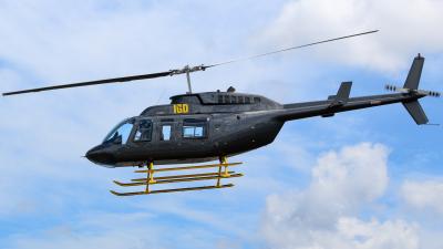 ZK-IGD, Bell 206L-3 LongRanger helicopter, in flight Photographed near Auckland, January 2022. The helicopter has landing skids.
