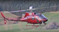Photo of the accident helicopter, a AS350 painted crimson