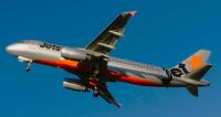 The incident aircraft, a Airbus A320 passenger jet viewed at low altitude from below with its landing gear down