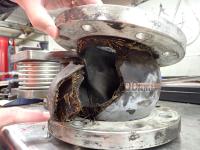 The ruptured rubber expansion joint. TAIC photo the ruptured rubber expansion joint