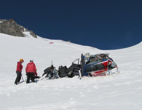 TAIC investigators examine the wrecked fuselage